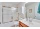 Bathroom with a vanity and an enclosed shower-tub at , Auburn, GA 30011