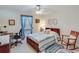 Comfortable bedroom with blue accents, carpet flooring, and a ceiling fan at , Auburn, GA 30011
