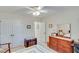 This primary bedroom has neutral walls, plush carpeting, and a ceiling fan at , Auburn, GA 30011