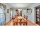Formal dining room featuring hardwood floors, wainscoting, a chandelier, and a large wooden table with seating for eight at , Auburn, GA 30011