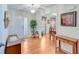 Inviting foyer with hardwood floors, a decorative table, and view into the dining room at , Auburn, GA 30011