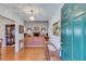 Welcoming foyer with hardwood floors, a pendant light, and a view into the living room at , Auburn, GA 30011