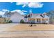 Charming home with a two-car garage, covered front porch and driveway at , Auburn, GA 30011