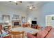 Spacious living room with a stone fireplace, vaulted ceilings, ceiling fans, and comfortable seating arrangement at , Auburn, GA 30011