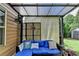 Cozy covered patio with a comfortable seating area and privacy screens at 1211 Chapel Estates Way, Dacula, GA 30019