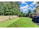 Well-maintained backyard with lush green grass, swing, hot tub and a privacy fence at 1211 Chapel Estates Way, Dacula, GA 30019