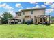 Expansive backyard with lush green grass, hot tub, covered patio and privacy fence at 1211 Chapel Estates Way, Dacula, GA 30019