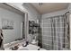 Bathroom featuring a single vanity, a tiled floor, and a shower and tub combination at 1211 Chapel Estates Way, Dacula, GA 30019