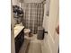 Compact bathroom with a light countertop and combination shower and bath at 1211 Chapel Estates Way, Dacula, GA 30019