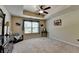 Spacious bedroom features a tray ceiling with fan, neutral walls, and natural light at 1211 Chapel Estates Way, Dacula, GA 30019
