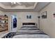 Bedroom featuring tray ceiling, carpeted floor, area rug, and shelving with toys at 1211 Chapel Estates Way, Dacula, GA 30019