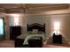 This is a well appointed bedroom with a trey ceiling, crown molding and great furniture pieces at 1211 Chapel Estates Way, Dacula, GA 30019
