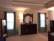 The primary bedroom has a tray ceiling, crown molding, windows, and lots of space at 1211 Chapel Estates Way, Dacula, GA 30019