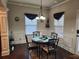 Charming breakfast nook with a round table, decorative curtains, and hardwood floors at 1211 Chapel Estates Way, Dacula, GA 30019