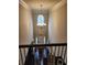 The home's grand foyer features soaring ceilings, a stunning chandelier, and a view of the front door at 1211 Chapel Estates Way, Dacula, GA 30019