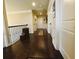 Long hallway with hardwood floors, paneled doors, and decorative trim at 1211 Chapel Estates Way, Dacula, GA 30019