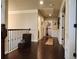 Hallway with hardwood floors, decorative trim, and natural light at 1211 Chapel Estates Way, Dacula, GA 30019