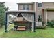 Inviting backyard hot tub beneath a gazebo, next to a bench, perfect for relaxation and outdoor enjoyment at 1211 Chapel Estates Way, Dacula, GA 30019
