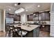 Spacious kitchen with a large center island, stainless appliances, and dark wood cabinets at 1211 Chapel Estates Way, Dacula, GA 30019