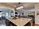 Open kitchen features a large island with granite countertops and a view to the living room at 1211 Chapel Estates Way, Dacula, GA 30019