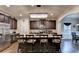 Large kitchen boasts a central island, stainless appliances, and dark cabinets at 1211 Chapel Estates Way, Dacula, GA 30019