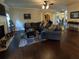 Spacious living room featuring a comfortable sectional sofa and hardwood floors at 1211 Chapel Estates Way, Dacula, GA 30019