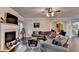 Inviting living room features a fireplace, dark hardwood flooring, and neutral paint at 1211 Chapel Estates Way, Dacula, GA 30019