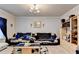 Cozy living room showcases stylish decor, a plush sofa, a sleek coffee table, and a modern entertainment center at 1211 Chapel Estates Way, Dacula, GA 30019