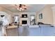 Spacious living room with a fireplace, large sectional sofa, and an open design to the dining and kitchen areas at 1211 Chapel Estates Way, Dacula, GA 30019