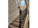 Elegant staircase features dark wood rails and white risers, adding charm and sophistication at 1211 Chapel Estates Way, Dacula, GA 30019