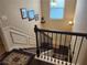 Detailed staircase with dark wood railing and carpet runner at 1211 Chapel Estates Way, Dacula, GA 30019