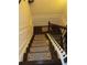 Staircase with decorative carpet runners and detailed wood trim at 1211 Chapel Estates Way, Dacula, GA 30019
