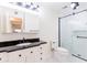 Updated bathroom featuring a tiled shower, black countertop, and updated fixtures at 3064 Chastain Park Ne Ct, Atlanta, GA 30342