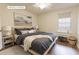 Comfortable bedroom features a window, side table, and large bed at 3064 Chastain Park Ne Ct, Atlanta, GA 30342