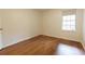 Bright bedroom featuring hardwood floors and a window for natural light at 3064 Chastain Park Ne Ct, Atlanta, GA 30342