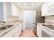 Well-lit kitchen with granite countertops and stainless steel appliances at 3064 Chastain Park Ne Ct, Atlanta, GA 30342
