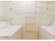 Laundry room featuring a washer, dryer, and shelving for storage at 3064 Chastain Park Ne Ct, Atlanta, GA 30342