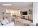 Bright living room featuring hardwood floors, modern furnishings, and an open floor plan at 3064 Chastain Park Ne Ct, Atlanta, GA 30342