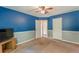 Bedroom featuring a ceiling fan, carpet, and two closets at 320 Creekside Trl, Covington, GA 30016