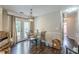 Dining area with hardwood floors and access to the backyard through sliding glass doors at 320 Creekside Trl, Covington, GA 30016