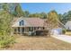 Charming single-story home with a well-maintained front yard and attached two car garage at 320 Creekside Trl, Covington, GA 30016