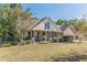 Inviting single-story home with a charming front porch and well-manicured lawn at 320 Creekside Trl, Covington, GA 30016