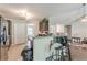 Eat-in kitchen bar area offering seamless flow to adjacent living spaces at 320 Creekside Trl, Covington, GA 30016