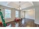 Open-concept living room with hardwood floors and a large window for natural light at 320 Creekside Trl, Covington, GA 30016