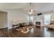 Spacious living room with vaulted ceilings, a fireplace, and hardwood floors at 320 Creekside Trl, Covington, GA 30016