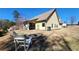 Inviting backyard featuring a stone fire pit, lounge chairs, and a covered patio at 275 Bridgemill Dr, Douglasville, GA 30134