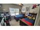 Large bedroom with two twin beds, an arcade game, and a window with natural light at 275 Bridgemill Dr, Douglasville, GA 30134