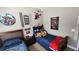 Fun ' room featuring two twin beds, playful decorations, and a neutral color scheme at 275 Bridgemill Dr, Douglasville, GA 30134