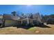 Charming home featuring a covered porch with classic shutters and a well-manicured lawn at 275 Bridgemill Dr, Douglasville, GA 30134