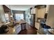 Well-equipped kitchen features granite countertops, stainless steel appliances, and dark hardwood floors at 275 Bridgemill Dr, Douglasville, GA 30134